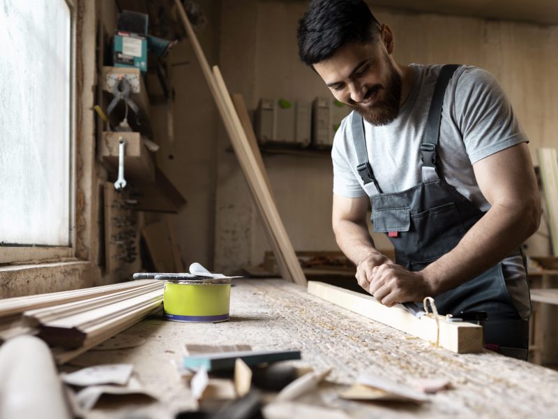 carpenter-cutting-mdf-board-inside-workshop (1)